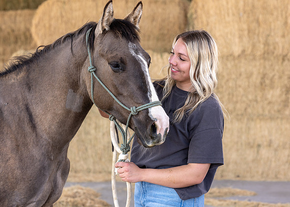 Rilie Vanderwiel, studying Animal Science, is right at home at the BYU-Idaho Animal Science Center.