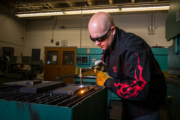 Students from the welding program, work on projects during class in the Austin Building.