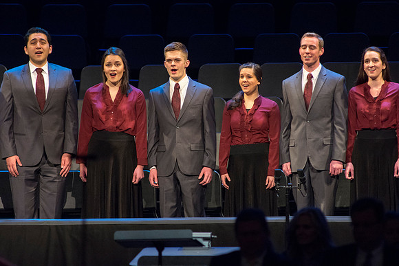 Vocal Union sing before President Clark G. Gilbert and his wife Christine Gilbert, speak together at devotional about the importance of building and maintaining families.