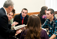 staged photo shoot of learning model in action with religion dept professor Lon Pyper.