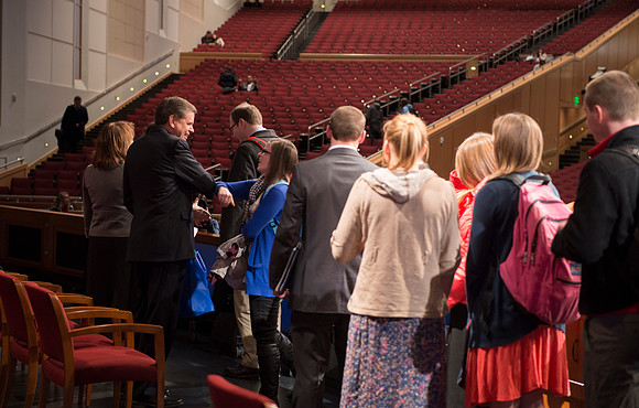 David L. Beck greets students after devotional in the BYU-Idaho Center.