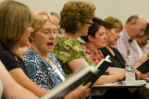 Women sing an opening song before class during Education Week 2013. Photo by Taylor Davenport