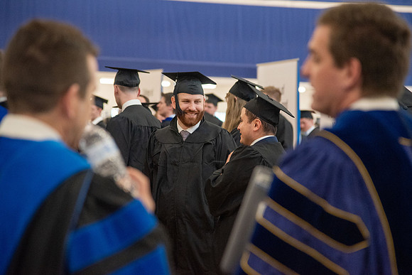 Student Graduates and Faculty meet in the I-Center for Commencement.
