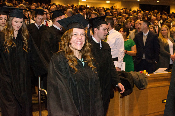 Graduates make their way to their seats.