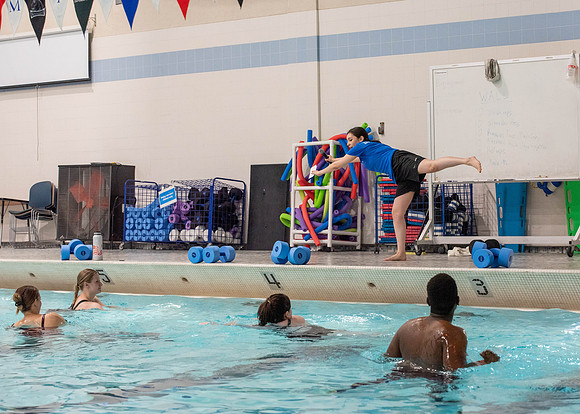 Students workout together in the pool at the Hart Building. Water Areobics Class taught by an instructor.