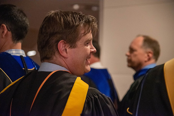 Student Graduates and Faculty meet in the I-Center for Commencement.