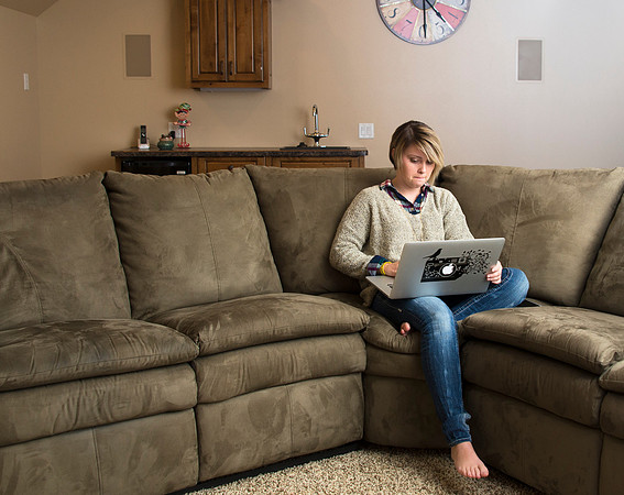 Online Student, Chance Beattie, works on assignments at home.