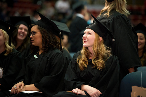Graduate Caitlin Olmstead smiles at her family before convocation begins.