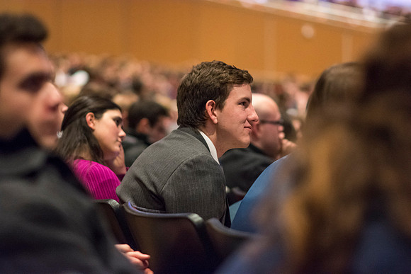 Students listen and take notes during devotional.