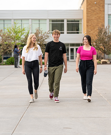 Student models for Admissions Viewbook cover options. May 2023