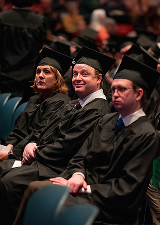 Students graduate and walk to receive their diplomas during convocation in the College of Physical Sciences and Engineering.
