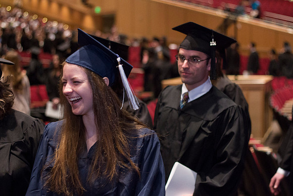 Graduates eagerly leave the I-Center at the end of Commencement during the 2014 Winter Semester Graduation.