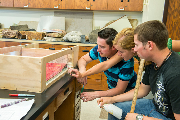 Nicole Rider, Jon Schmidt and Ryan Ronson work together on a Structural Geology Lab assignment: Analog modeling of thrust faults and compression.