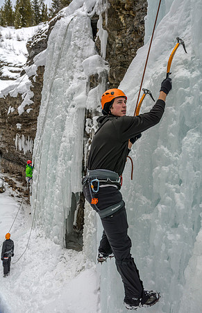 Davin Lybbart climbing on the ice face.