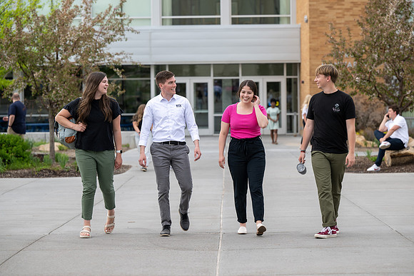 Student models for Admissions Viewbook cover options. May 2023