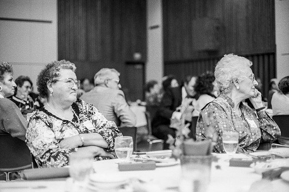 Members of the audience listen to the quartet sing a number