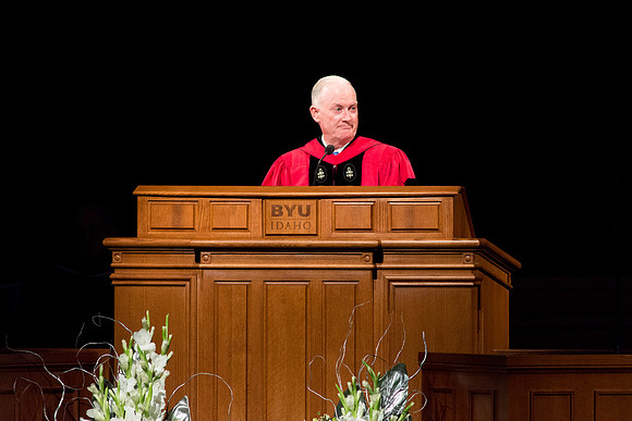 Elder Kim B. Clark giving a speech to the graduates at Commencement