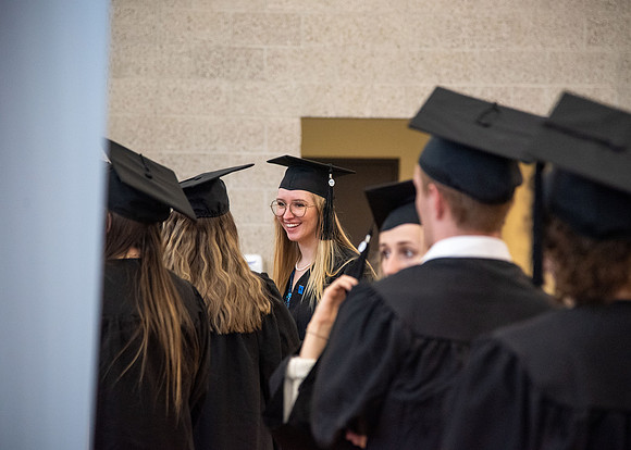 Student Graduates and Faculty meet in the I-Center for Commencement.