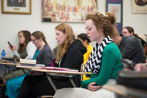 Students sing a hymn in the beginning of their religion class, Jesus Christ and the everlasting gospel.