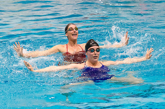 Synchronized Swimmers performing at the half time show