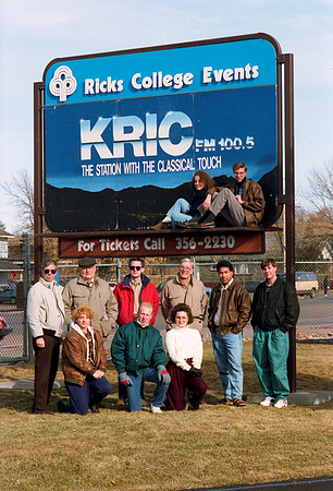 KRIC Radio group members in front of the Billboard.