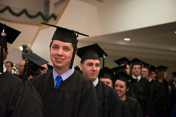 Graduates gather outside the doors in the I-Center before Commencement begins.
