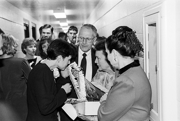 Sister Bednar recieving a Lei from one of the guests