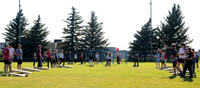 Students gather at the upper field for various 4th of July activities.