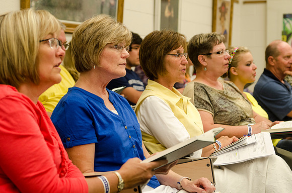 Women sing an opening song before class during Education Week 2013. Photo by Taylor Davenport