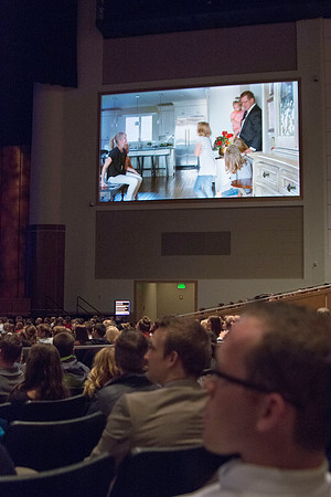 President Clark G. Gilbert and his wife Christine Gilbert show a video about their family as they speak together at devotional about the importance of building and maintaining families.