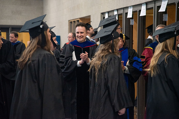 Student Graduates and Faculty meet in the I-Center for Commencement.