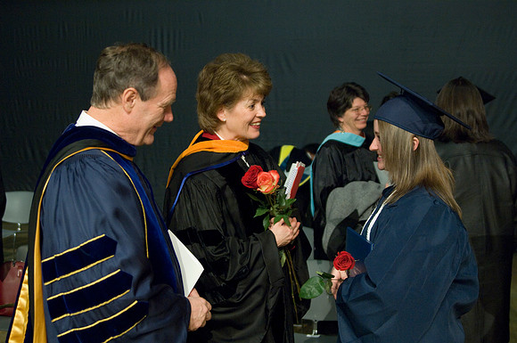 Kassie Burton a Nursing graduate from Muscatine, Iowa greets Br. &amp; Sis Tanner after the colege of Agriculture and Life Sciences Convocation.