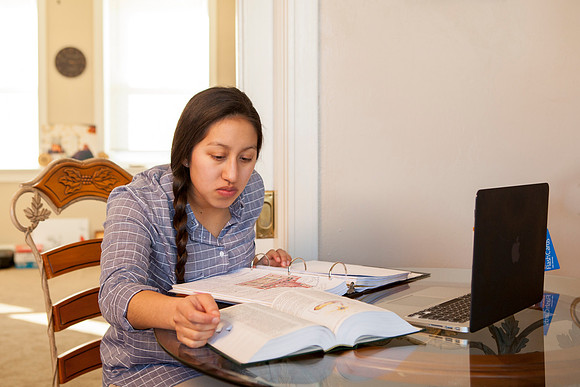 Tanya Rickenbach studies online at BYU-Idaho in her quiet apartment.