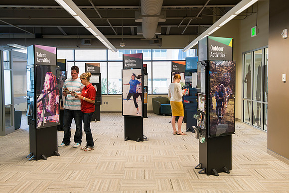 Kiosks in the student Activities area highlight the variety of opportunities students have to get involved at BYU-Idaho. (Tyrell, Kelly and Venessa)