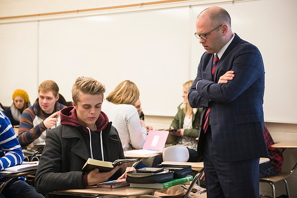 Student, James Witten, asks Brother Peterson to expound on a specific scripture in religion class.