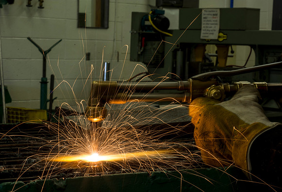 Students from the welding program, work on projects during class in the Austin Building.