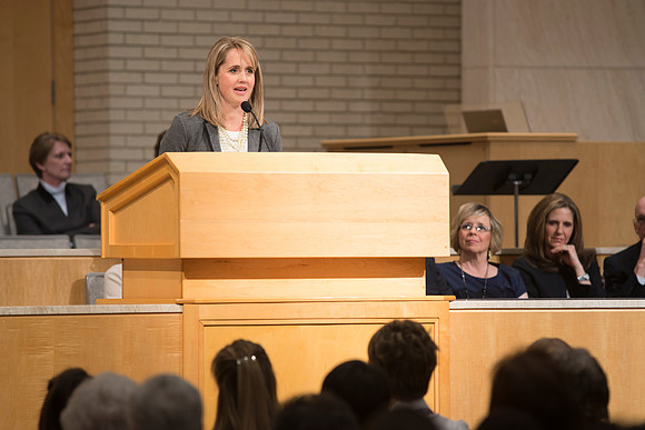 Sister GIlbert introduces Sister Bednar in A Gathering for Women in the Taylor Chapel.