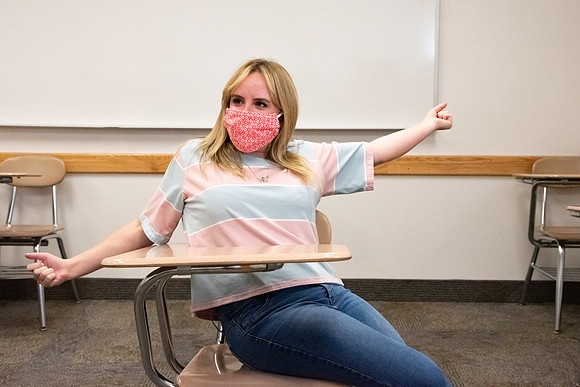 Examples of students staying safe and healthy during the COVID-19 pandemic by social distancing, following pathway arrows, and wearing face masks.