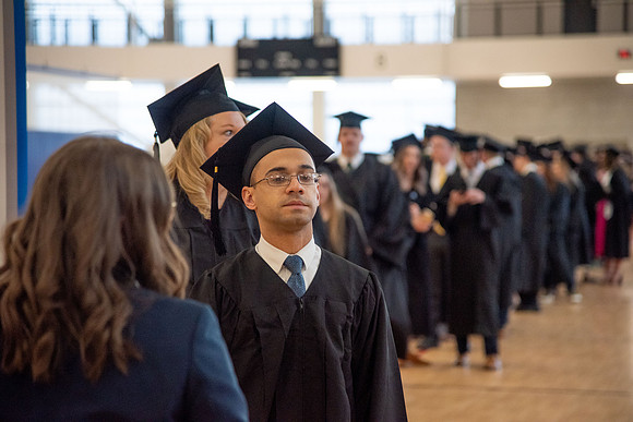 Student Graduates and Faculty meet in the I-Center for Commencement.