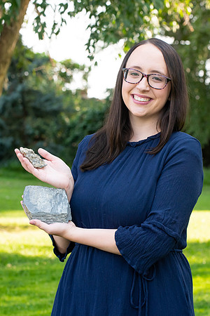 Rachel Tullis, an interdisciplinary science major, studying geology and biology. Rachel with some of her favorite rocks with fossils. Photo for LDS Philanthropies.