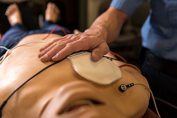 Cory Marriott and his peer pass off EMT requirements during lab held in the Clarke Building.