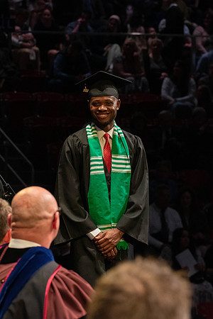 Students graduate and walk to receive their diplomas during convocation in the College of Physical Sciences and Engineering.
