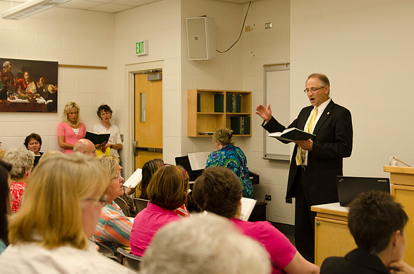 Instructor Mark Seare conducts the opening song before teaching his class, "Understanding our Eternal Identity" during Education Week 2013. Photo by Taylor Davenport