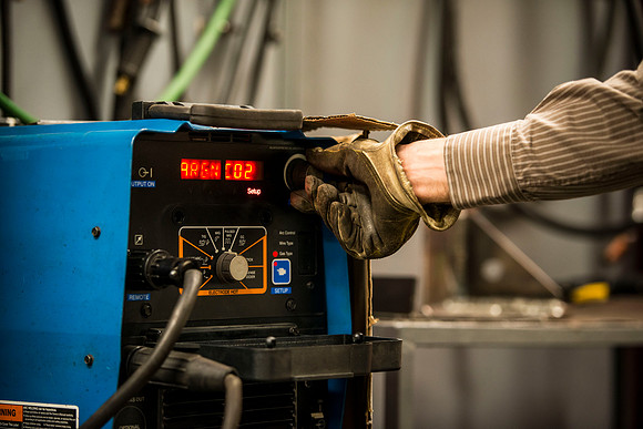 Clay Rasmussen, from the Mechanical Engineering Department, welds during a demonstration.