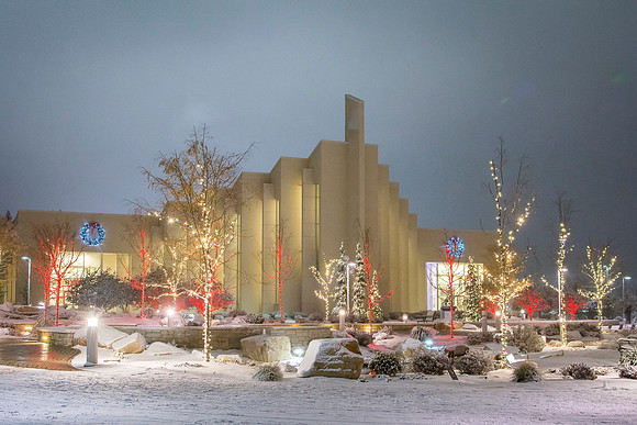 Christmas lights aglow with new snow shine bright around the BYU-Idaho Taylor Building
