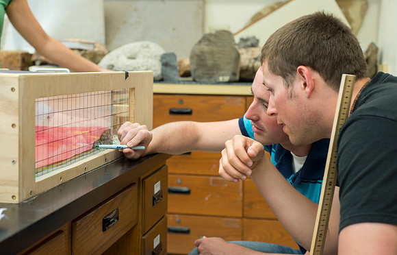 Jon Schmidt and Ryan Ronson work together on a Structural Geology Lab assignment: Analog modeling of thrust faults and compression.