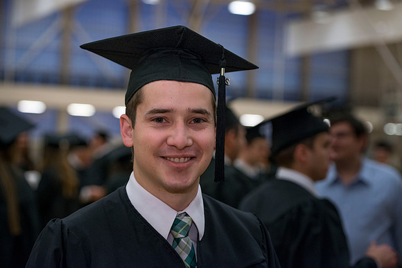 Josh Elg waits in the I-Center for Convocation to begin.
