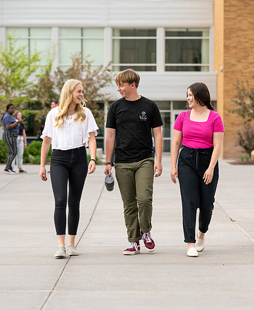 Student models for Admissions Viewbook cover options. May 2023