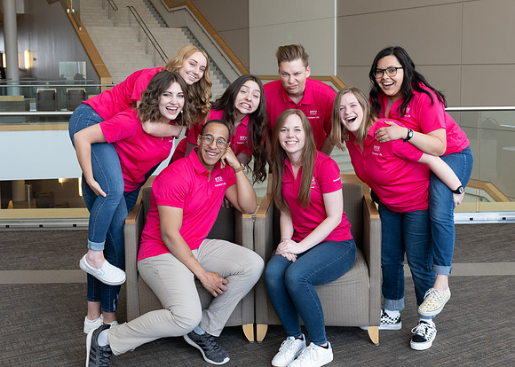 Students who are a part of the Campus Life organization take group photos.