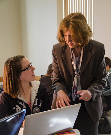 Communications Instructor Robyn Bergstrom helping a student.
